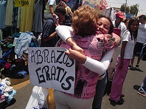 'FREE HUGS' in a marketplace, Chile