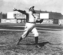 Cy Young--the holder of many major league career marks, including wins and innings pitched, as well as losses--in 1908. MLB's annual awards for the best pitcher in each league are named for Young. Cy young pitching.jpg