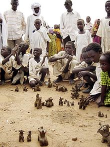 Children in the camps are encouraged to confront their psychological scars. The clay figures depict an attack by Janjaweed. Darfur report - Page 7 Image 1.jpg