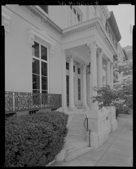 Photo of the Hackerman House Detail view of the entrance to the Hackerman House; note the decorative ironwork at the windows as well as the ornamental window lintels that are supported by console brackets and topped HALS MD-1-41.tif