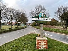 Sign at the entrance to Holme Hale village Holme Hale village sign.jpg