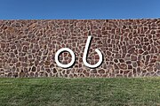 The Kokernot Ranch "06" brand on a rock wall at Kokernot Field.