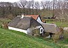 Perceelsgedeelte van een kleine gepleisterde boerderij