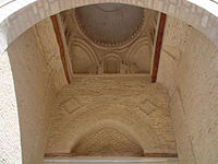 Vue intérieure de la coupole, reposant sur des trompes à trois voussures concentriques, du porche de Bab al-Gharbi.