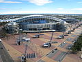 Der Sydney Olympic Park im Jahr 2007. Im Vordergrund das zurückgebaute Olympiastadion (damals: Telstra Stadium) und rechts dahinter die Acer Arena.