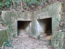 Two tunnel entrances with "Regent Street" and "Shaftesbury Avenue" etched above, surrounded by vegetation