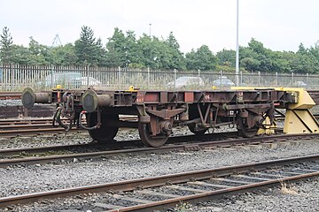A barrier vehicle at NI Railways' York Road yard. It has an instanter coupler and buffers at one end for use by 111 Class or 201 Class diesel locomotives and Dellner couplers at the other end for use with DeDietrich carriages.