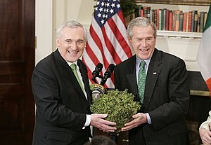 President George W. Bush accepts a bowl of sha...