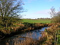 A view of the old Glazert ford at Haysmuir, with the Bonshaw woodlands in the background. One rail is left of an old footbridge.