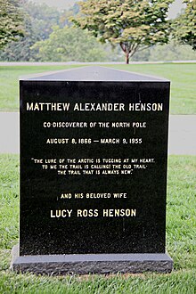 Tombstone with the words "Matthew Alexander Henson/Co-Discoverer of the North Pole/August 8, 1866-March 9, 1955/"The Lure of the Arctic is Tugging at my Heart; To Me the Trail is Calling, The Old Trail, The Trail that is Always New"/and his beloved wife/Lucy Ross Henson"