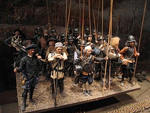 A model of a section of a pike and shot formation from the Thirty Years' War on display at the Army Museum in Stockholm. Consistent (uniform) dress was not common for military troops at the time. Pike and shot model.jpg