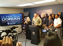 Major General Roy V. McCarty of the South Carolina National Guard and Governor Henry McMaster conduct a briefing on the hurricane. SC National Guard Dorian Briefing.jpg