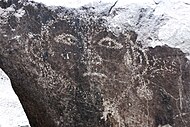 A petroglyph depicting a face or mask.