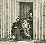 This is a black and white photo of Grant, his wife Julia, and son Jesse at City Point.