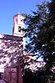Vista parcial de la ilesia parroquial de Valacloche (Teruel), con detalle de la torre-campanariu (2017).