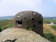 Photo d'une cloche GFM, cloche blindée surmontant le bloc fortifié et abritant guetteur et fusil mitrailleur