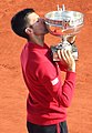 Image 17Novak Djokovic, the 2023 men's singles champion. It was his record-breaking twenty-third major title and his third at the French Open. (from French Open)