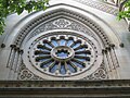 Elizabeth Street wheeled window. Reinforced concrete spokes were added to the inside of this window during World War II for protection against blast damage.[1][page needed]