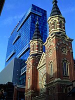 Romanesque style St. Mary Roman Catholic Church (1885) by architect Peter Dederichs in Greektown. GreektownCasinohotelandStMaryRCChurchDetroit.jpg