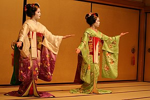 Two maiko performing in Gion.