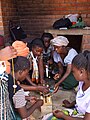 Image 20Mbawemi Women's group in Malawi learning how to add value to beeswax by making candles (from Malawi)