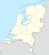 Mapa konturowa Holandii, blisko centrum na lewo znajduje się punkt z opisem „Rotterdam”