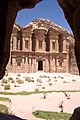 A framed view of Petra's Monastary (al-Deir) from a nearby cave