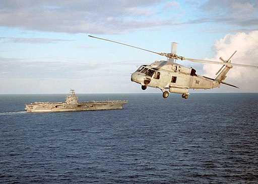 US Navy 030204-N-0275F-501 An SH-60F of Helicopter Anti-Submarine Squadron Three (HS-3), patrols the water near Theodore Roosevelt