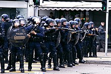 Swiss Kantonspolizei Zurich riot police officers attempting to control May Day riots in 2008 Zurich police riot control.jpg