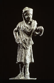 Bronze statue of a Greek actor. He wears a man's conical cap but female garments, following the Greek custom of men playing the roles of women. 150-100 BCE. Greek - Actor - Walters 541067.jpg