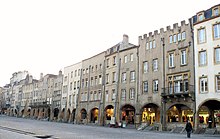 Arcade with shops behind, running along a row of originally High Medieval houses in Metz, France. Metz - Place Saint-Louis -622.jpg