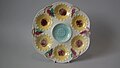 Oyster plate, 9.6 ins., coloured glazes, c. 1881, sunflower pattern.