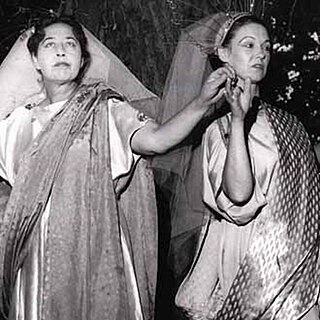 A black and white photo of two actors in elaborate robes, performing a scene from The tempest by William Shakespeare