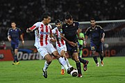 Players of Wydad Casablanca and Al Ahly face off during a 2011 CAF Champions League match.