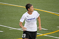 Wambach in a soccer pitch wearing the MagicJack uniform.
