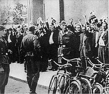 Lapanka - Polish civilian hostages captured by German soldiers on the street, September 1939 Lapanka.jpg