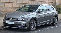 Front-three-quarter view of a five-door car which is fitted with door mirrors, flush headlamps, body-coloured bumpers, fog lamps, dark-tinted rear windows, and alloy wheels.