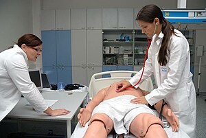 Students working with an artificial patient (F...