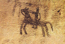 Prehistoric cave painting, depicting a horse and rider Cave painting in Doushe cave, Lorstan, Iran, 8th millennium BC.JPG