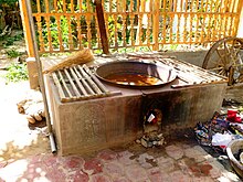 Silk dye in pan on stove. Khotan Dye in pan on stove. Khotan, Xinjiang.jpg