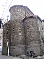 Photograph of a brick building on a city street.