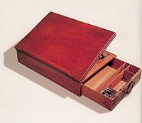 the Declaration of Independence desk with it's drawer open on a white background