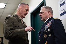 General Joseph Dunford, chairman of the Joint Chiefs of Staff, speaks with Milley before the 2018 Army-Navy Game. Joseph Dunford and Mark Milley 181208-D-SW162-0396 (31298827337).jpg