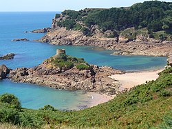St. Brelade's coastline of promontories and bays includes Portelet and its tidal island, L'Île au Guerdain with Portelet Tower (also known as Janvrin's Tomb)