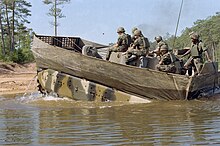 A M2 Bradley configured for swimming, Fort Benning, June 1983 M2 Bradley exiting the water at Victory Pond, 1983.jpg