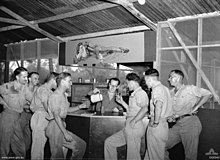 RAAF No. 12 Squadron pilots in the mess at Merauke in December 1943 No 12 Squadron aircrew Merauke Dec 1943.jpg