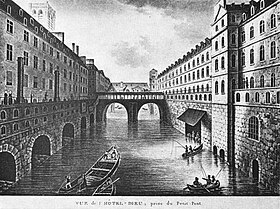 Le pont Saint-Charles sur la Seine entre les deux bâtiments de l'Hôtel-Dieu, pris du Petit-Pont, vers 1850