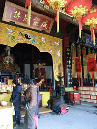 Worshipers at the Temple of the City God of Suzhou, Jiangsu. Is it Taoism or folk religion? To the general Chinese public they are not distinguished, but a lay practitioner would hardly claim to be a "Taoist", as Taoism is a set of doctrinal and liturgical functions that work as specialising patterns for the indigenous religion. Worship in Suzhou City God Temple.png