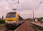 An SNCB Class 13 electric locomotive is at the head of a passenger train at Eupen railway station, Belgium, in June 2007