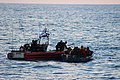 A Robert Yered small boat crew gives life jackets to 50 Haitian migrants approximately 46 miles north of Cap Haïtien, Haiti, May 20, 2019.[13]